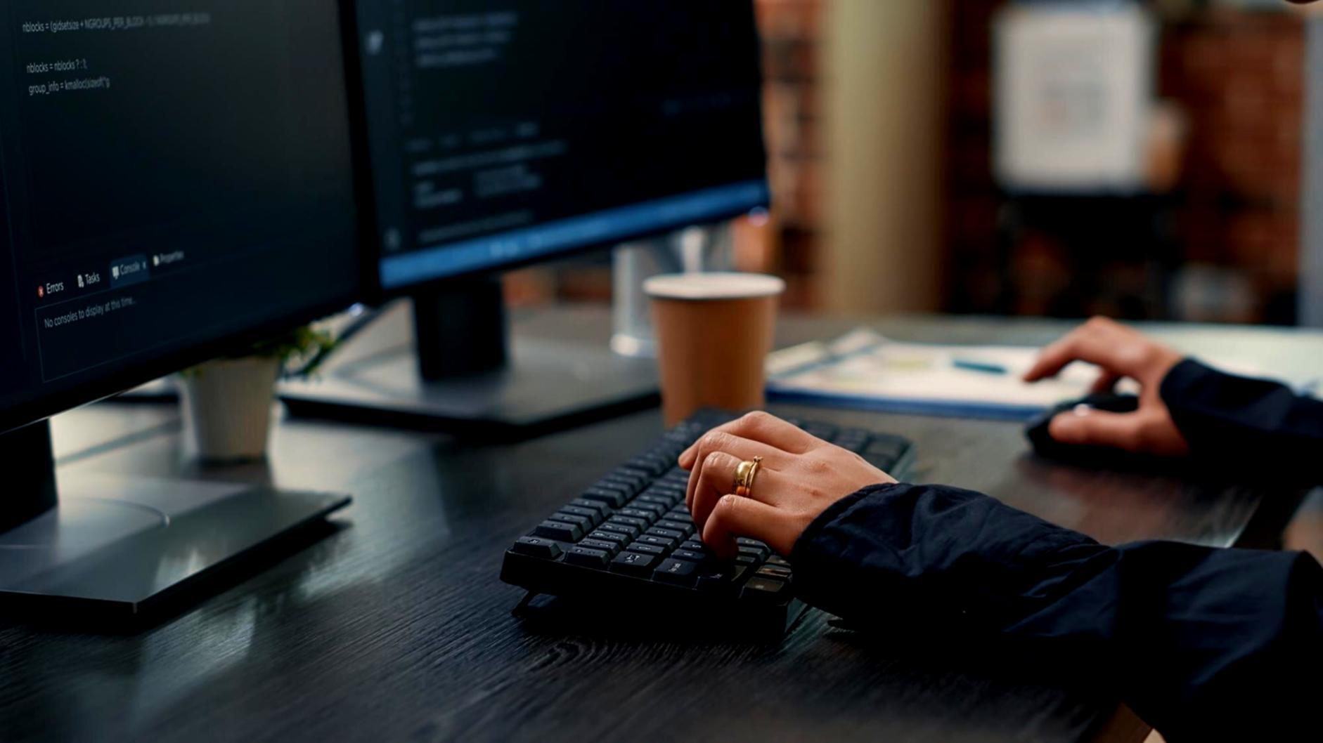 Students collaborating on algorithm design challenges in modern learning environment